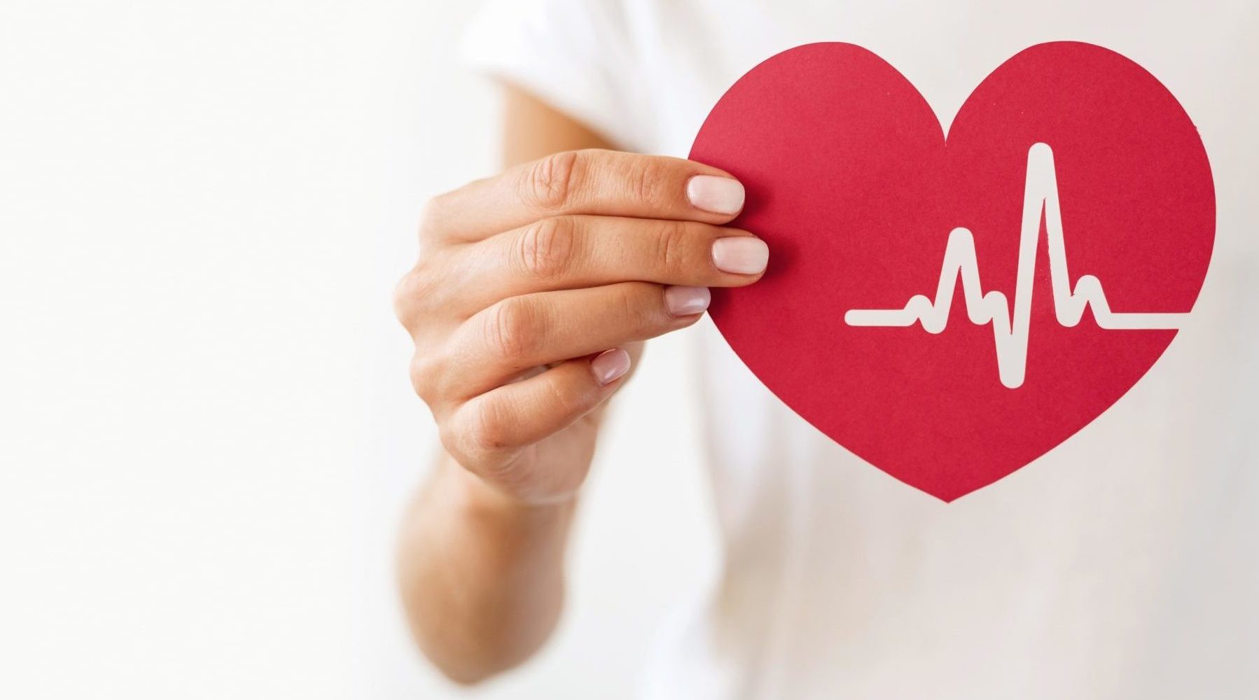 front-view-of-woman-holding-paper-heart-with-heartbeat